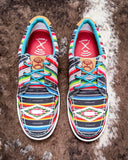 The Paloma Pop Twisted X Hooey Loper displayed on cowhide.