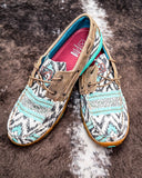 The Trailblazer Twisted X Boat Shoe Driving Moc displayed on cowhide.