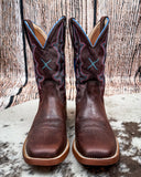 Front view of the Taffy Twisted X Women's 11" Tech X Boot on cowhide with a wood backdrop.
