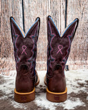 Back view of the Taffy Twisted X Women's 11" Tech X Boot on cowhide with a wood back drop.