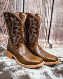 Side view of the Rio Twisted X Women's 11" Tech X Boot displayed on cowhide with a wood backdrop.