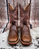 Front view of the Sandi Twisted X Women's 11" Tech X Boot displayed on cowhide with a wood backdrop.