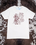 The Still in The Saddle Graphic Tee displayed on cowhide.