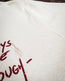 Zoom in of the Still in The Saddle Graphic Tee showing detailed splatter print.