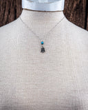 The Thunderbird Charm Genuine Turquoise Necklace shown on a mannequin.