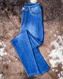 The Midnight Range Skinny Jeans displayed on cowhide.