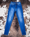 Front view of the Midnight Range Skinny Jeans displayed on cowhide.