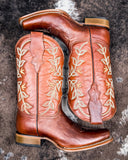Rustwood Rodeo Circle G Boots laying on cowhide.