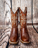 Front view of the Rustwood Rodeo Circle G Boots in  front of a wood backdrop.
