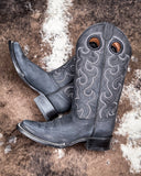 The Coal Canyon Circle G Boots displayed on cowhide.