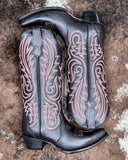 The Ironclad Rodeo Circle G Boots displayed on cowhide.