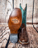 Sole view of the Serpent Spur Circle G Boots in front of a wood backdrop.