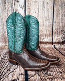 Side view of the Serpent Spur Circle G Boots in front of a wood backdrop.
