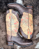 The Bronco Belle Circle G Boots displayed on cowhide.