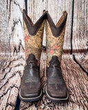 Front view of the Bronco Belle Circle G Boots in a wood backdrop.