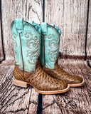 Side view of the Stormbird Ostrich Corral Boots in front of a wood backdrop.