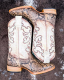 The Sundance Python Corral Boots displayed on cowhide.