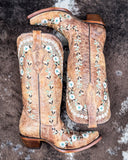 The Rodeo Afterglow Corral Boots displayed on cowhide.