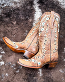 The Rodeo Afterglow Corral Boots displayed on cowhide.