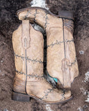 The Barbed Trailblazer Corral Boots displayed on cowhide.
