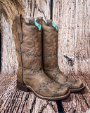 Side view of the Barbed Trailblazer Corral Boots in a wood backdrop.
