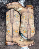 The Stormlash Corral Boots displayed on cowhide.