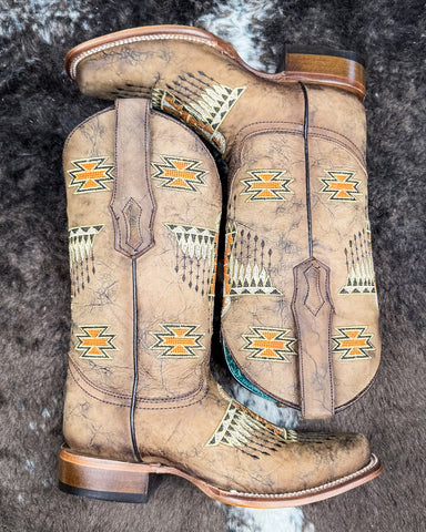 The Stormlash Corral Boots displayed on cowhide.