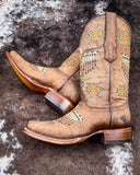 The Stormlash Corral Boots displayed on cowhide.