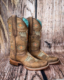 Side view of the Stormlash Corral Boots in a wood backdrop.