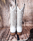 Back view of the Saddlebrush Rose Circle G Boots in a wood background.