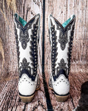 Back view of the Phantom Mesa Corral Boots in a wood backdrop.