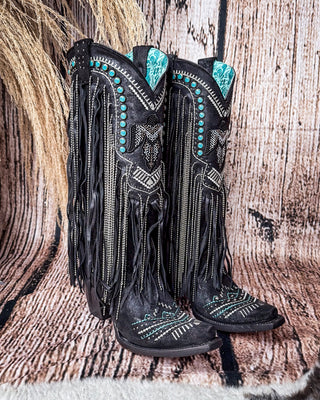 Side view of the Blackridge Stampede Corral Boots with a wood backdrop.