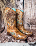 Side view of the Sandstone Stallion Corral Boots in a wood backdrop.