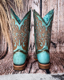 Back view of the Honey Dust Trailblazer Corral Boots with a wood backdrop.