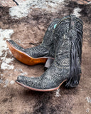 The Dahlia Dust Corral Boots displayed on cowhide.