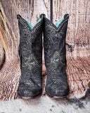 Front view of the Dahlia Dust Corral Boots with a wood backdrop.