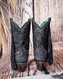 Back view of the Dahlia Dust Corral Boots with a wood backdrop.