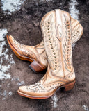 The Phantom Dune Corral Boots displayed on cowhide.