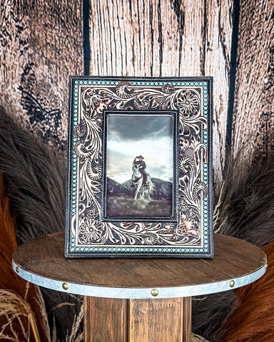 Front view of the Myra Bag - Mesa Plateau Photo FramePhoto Frame on a wood background.