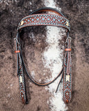 Turquoise Rawhide Browband Headstall displayed on cowhide.