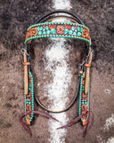 Painted Cactus Browband Headstall displayed on cowhide.