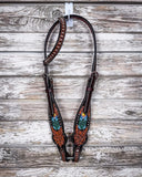 Beaded Cactus One Ear Headstall displayed on a wood background.