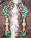 Painted Cactus Ladies Spur Straps displayed on cowhide.