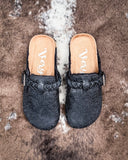 Iris Tooled Slip on Mule in Black by Very G displayed on cowhide.
