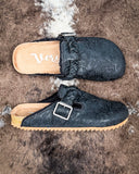 Iris Tooled Slip on Mule in Black by Very G displayed on cowhide.