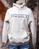 The Trophy Ladies Hooey Hoodie in Oatmeal on a mannequin.