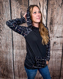 Cinched Up T-Shirt Hoodie on a model in front of a wood backdrop.