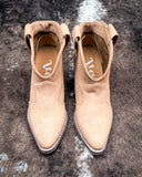 Dangerous Ankle Bootie in Light Tan displayed on cowhide background.