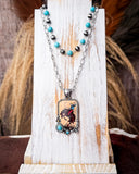 Wild West Layered Fashion Necklace displayed on wood in front of wheat background.