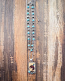 Wild West Layered Fashion Necklace displayed next to ruler on wood background.